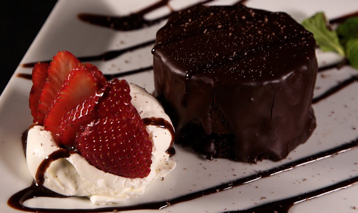 a piece of chocolate cake and ice cream on a plate